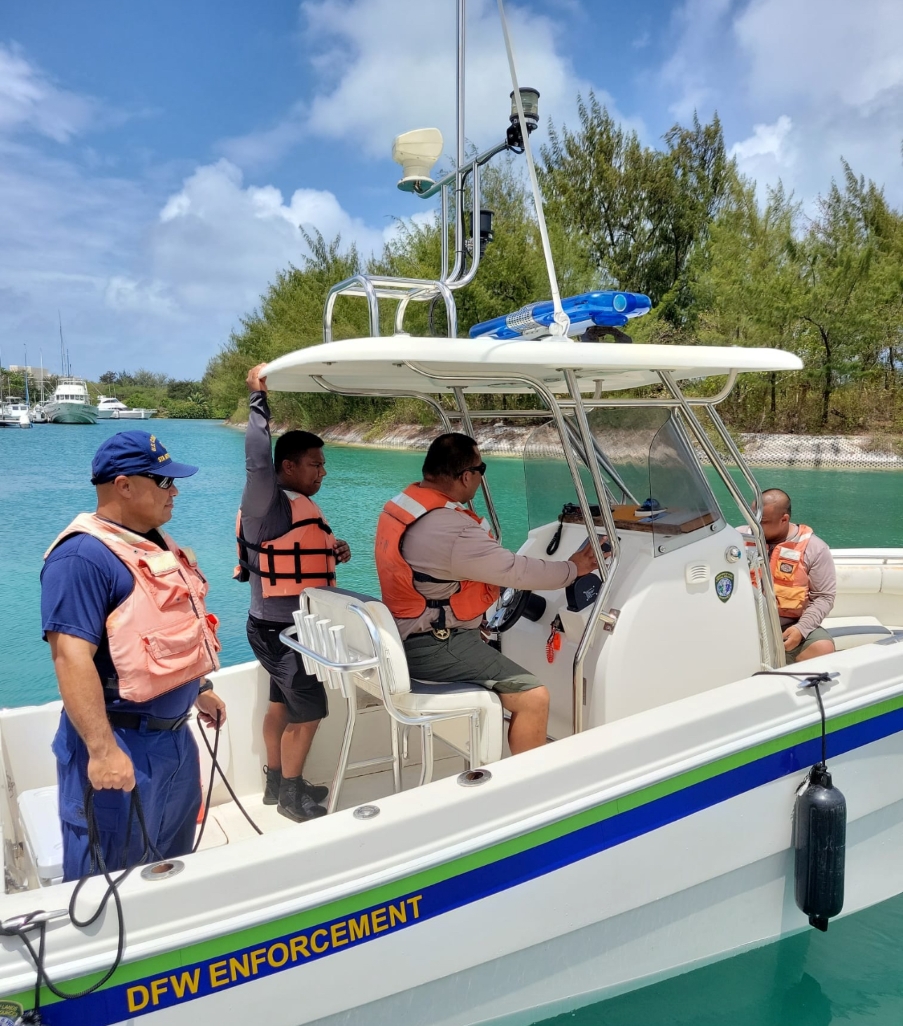 Staff on Boat with coast guard