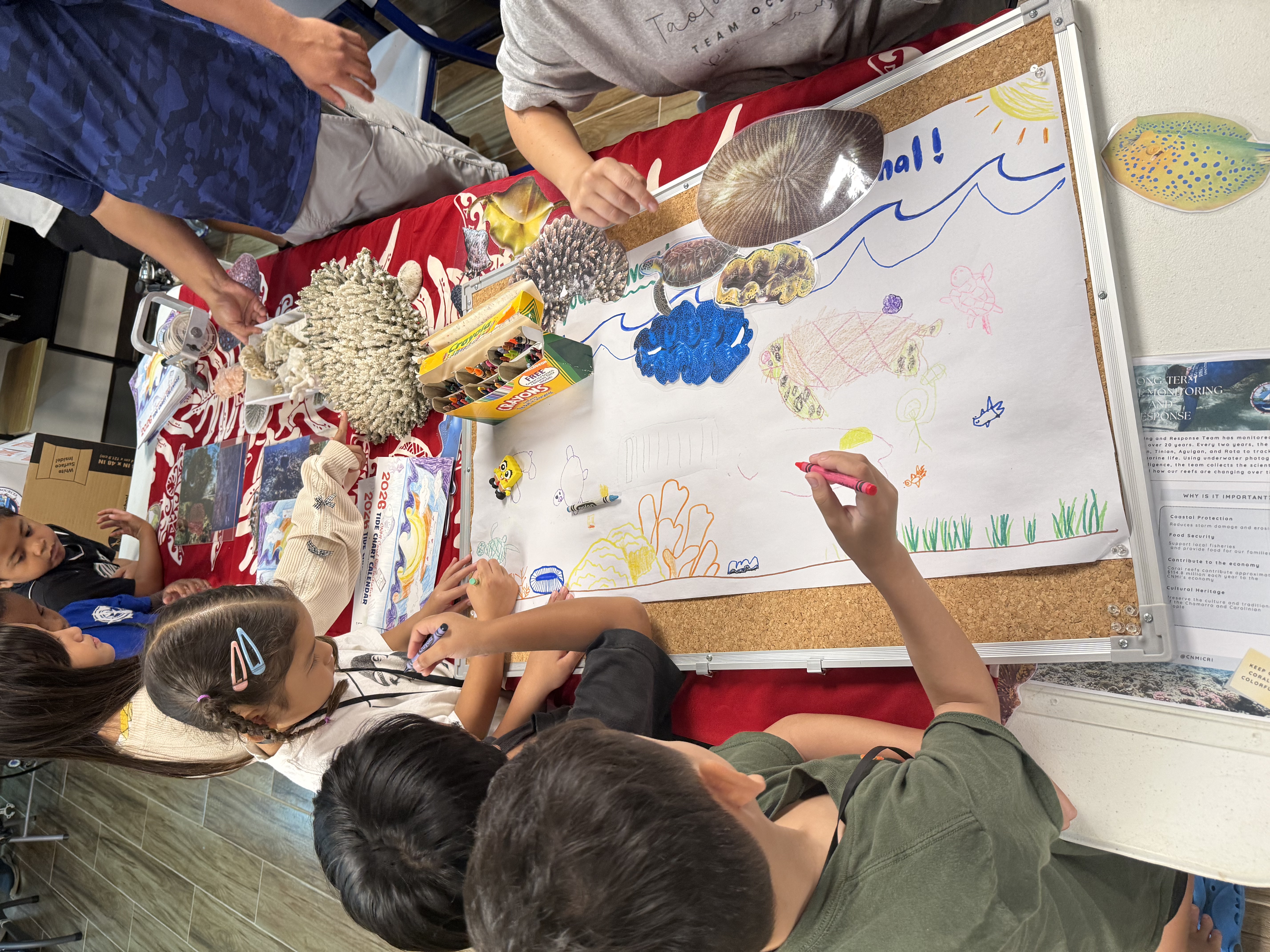 children coloring at the summer youth camp